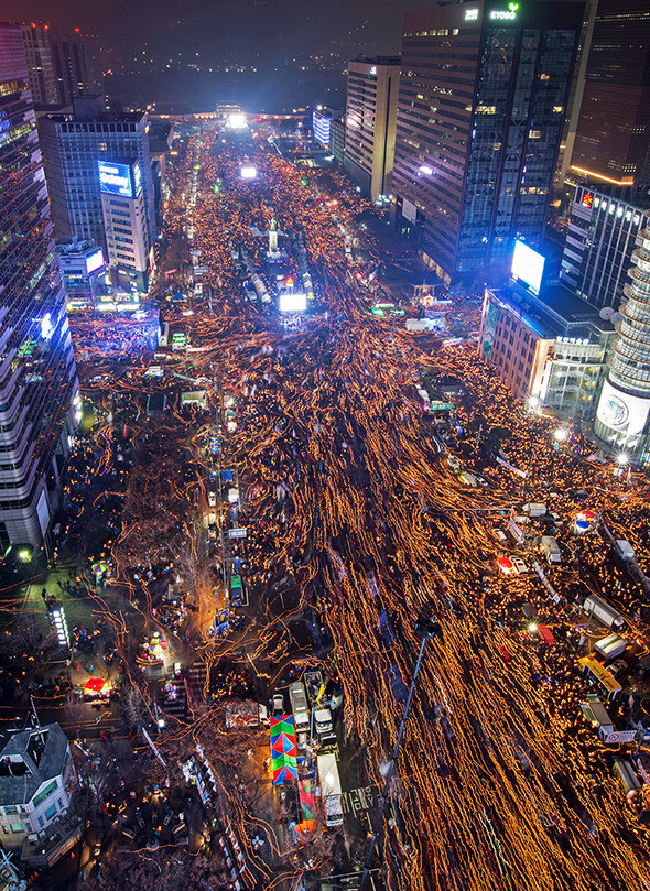 Thousands of citizens gather at Gwanghwamun Square in central Seoul to express their anger over the Choi Sun-sil scandal