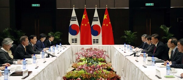 South Korean President Moon Jae-in and Chinese President Xi Jinping hold a bilateral summit during the Asia-Pacific Economic Cooperation (APEC) summit in Port Moresby