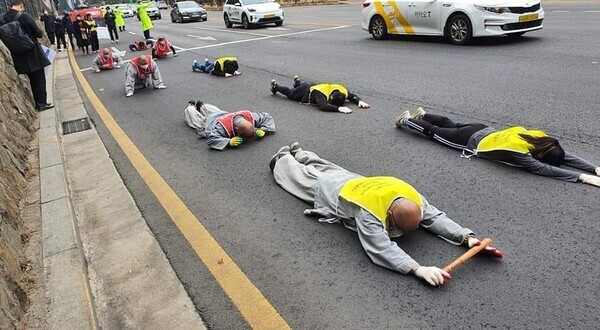 Monks from the Jogye Order of Buddhism, South Korean activists and monks from Myanmar hold a full-body prostration march Friday to protest the coup in Myanmar. (provided by the Buddhist Solidarity for Environment)