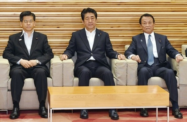 Japanese Prime Minister Shinzo Abe (center) during a meeting discussing South Korea’s removal from Japan’s white list of trading partners on Aug. 2.