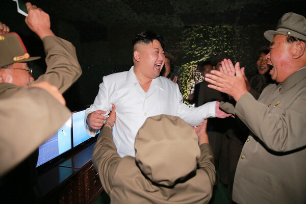 North Korean leader Kim Jong-un celebrates the successful launch of a submarine-launched ballistic missile (SLBM) off North Korea’s coast into the East Sea off of Sinpo