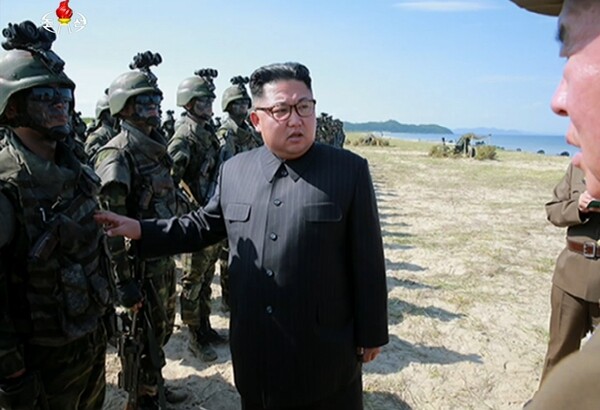 North Korean leader Kim Jong-un conducts an inspection of special forces units who were participating in a training for a hypothetical occupation of the South Korean islands of Beaengnyeong and Yeonpyeong Islands on Songun Day