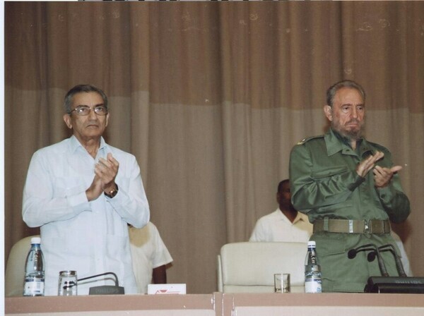 Cuban President Fidel Castro (right) celebrates the launch of the Henry Reeve International Medical Brigade in 2005. Reeve was a brigadier general during the First Cuban War of Independence. (provided by Jeong)