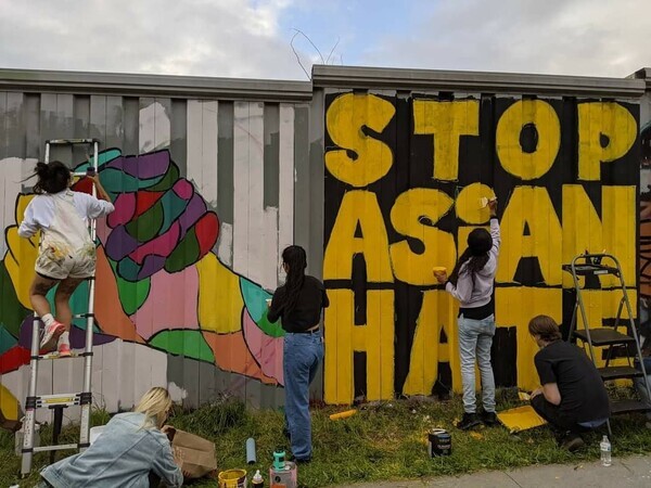 Korean American students in the Atlanta area paint a mural that says “Stop Asian Hate.” (Crystal Jin Kim)