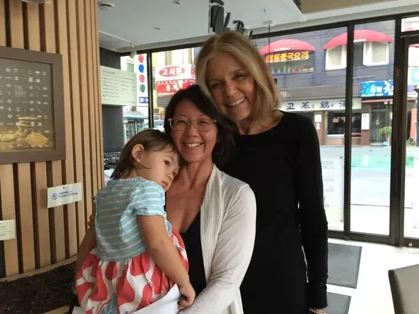 Gloria Steinem and Christine Ahn, along with Ahn&rsquo;s daughter, Jeju. (courtesy Christine Ahn)