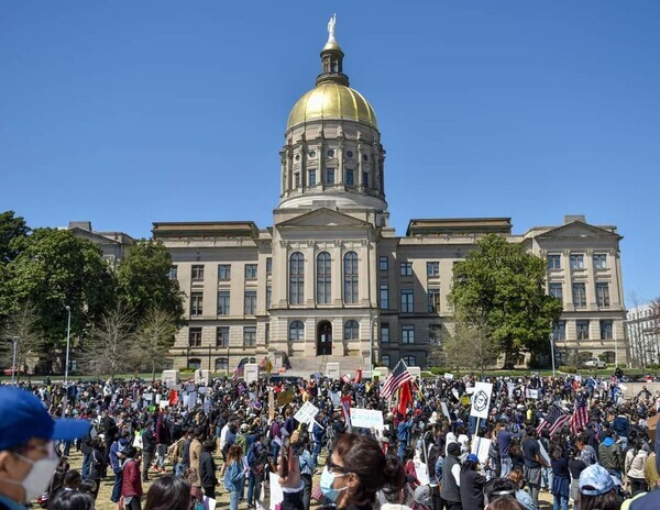 People gather in front of Georgia State Capitol to condemn hate crimes targeting people of Asian descent on March 20. (Sun Kim)