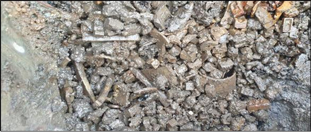Metal type pieces are pictured when they were discovered in an earthenware jar that had been unearthed. (provided by the Sudo Research Institute of Cultural Heritage)
