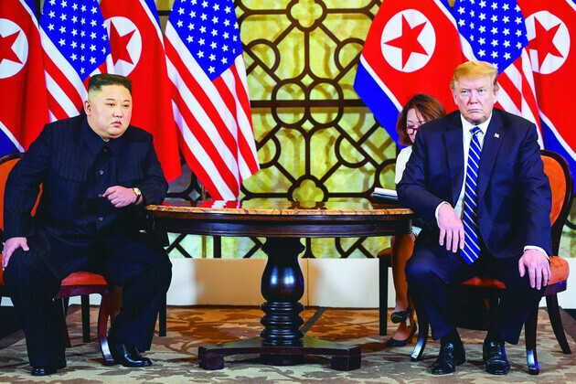 Then US-President Donald Trump and North Korean leader Kim Jong-un hold their second summit in Hanoi, Vietnam, on Feb. 28, 2019. (AFP/Yonhap News)