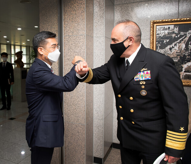 South Korean Defense Minister Suh Wook exchanges a fist bump with US Adm. Charles Richard, commander of the US Strategic Command, in Seoul on Wednesday. (provided by the Ministry of National Defense)