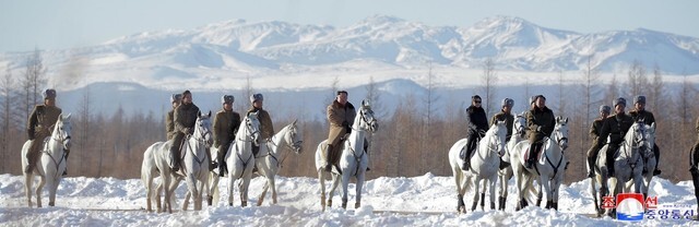 An image of North Korean leader Kim Jong-un ascending Mt. Baektu on horseback with Pak Jong-chon, chief of the General Staff of the Korean People’s Army, and other military leaders published by the Korean Central News Agency (KCNA) on Dec. 4. (Yonhap News)