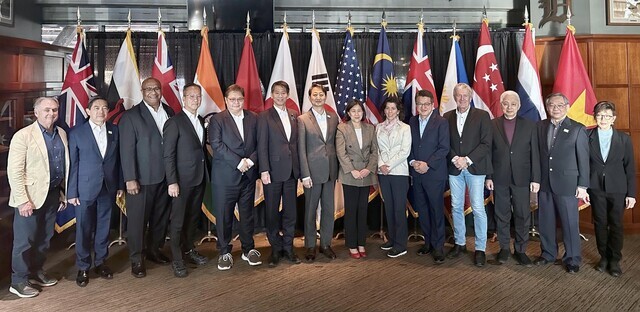 Ahn Duk-geun, South Korea’s minister for trade (seventh from left), stands for a photo with his counterparts at the ministerial-level IPEF meeting in Detroit, Michigan, on May 27. (courtesy of the MOTIE)