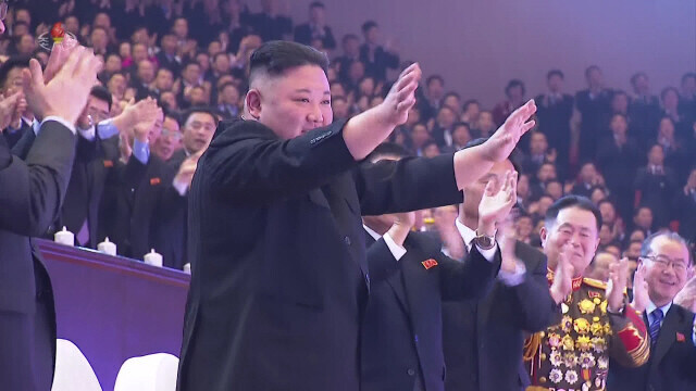 North Korean leader Kim Jong-un waves his hands after attending a performance celebrating the Eighth Workers’ Party of Korea Congress on Jan. 14. (Yonhap News)