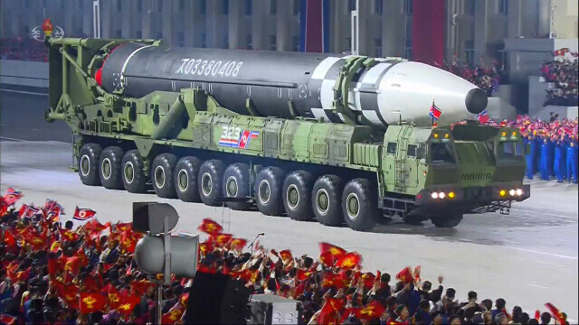 During a parade held in Pyongyang on Oct. 10, 2020, to mark the 75th anniversary of the founding of the Workers’ Party of Korea, North Korea unveiled a new ICBM that could reach the US mainland. This image, aired on Korean Central Television, shows the new ICBM was longer than its Hwasong-15 with a thicker diameter. A transporter erector launcher sporting 22 wheels carried the new ICBM. (Yonhap News)