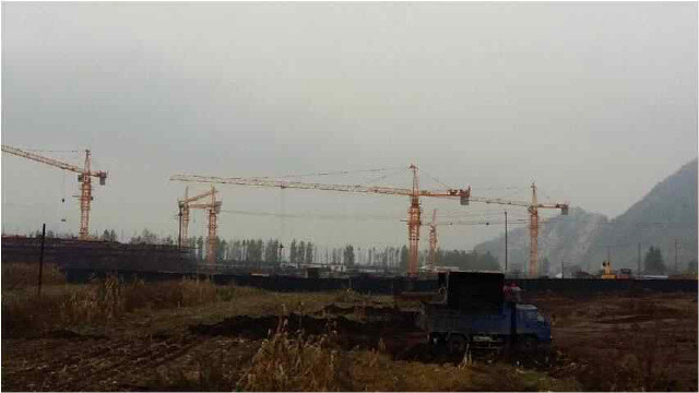 Cranes and trucks at the construction site for a special economic zone along the North Korea-China border