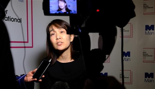 Author Han Kang responds to reporters’ questions after being awarded the Man Booker International Prize