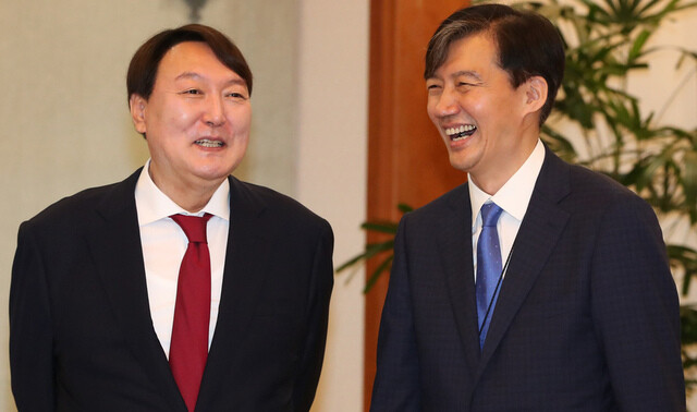 Prosecutor-General Yoon Seok-yeol and then Senior Presidential Secretary for Civil Affairs Cho Kuk at the Blue House on July 25. (Kim Jung-hyo