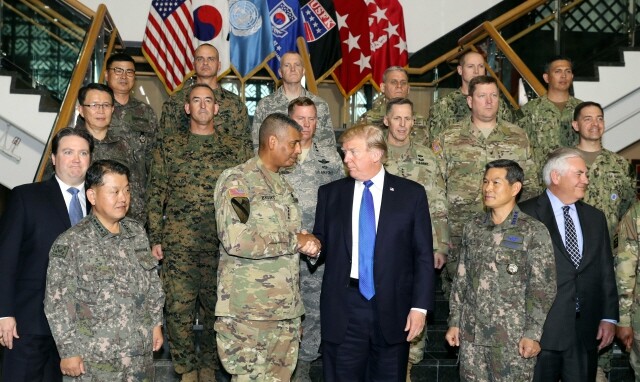 President Trump poses for a photo with Gen. Vincent K. Brooks