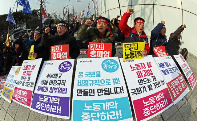 Korean Confederation of Trade Union members protest the proposed labor reform bill in front of the National Assembly building on Yeouido