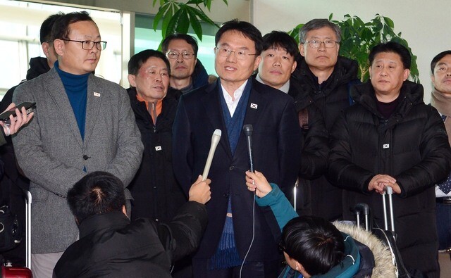 Park Sang-don (in the gray jacket on the left)