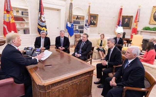 US President Donald Trump in a meeting with key personnel on Aug. 24. Pictured from the left are Andrew Kim