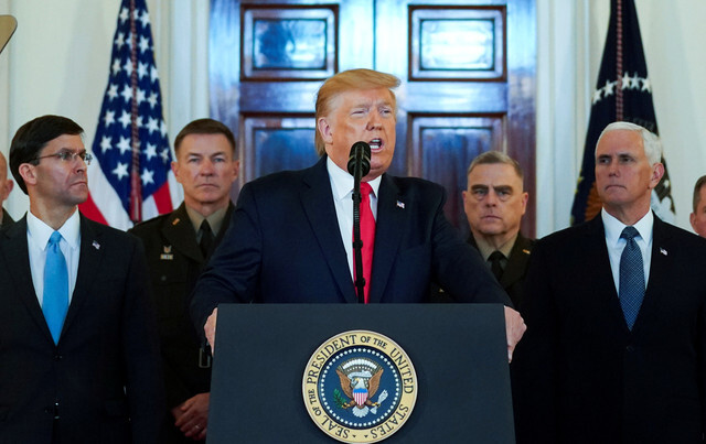 US President Donald Trump announces that Washington will respond to Iranian missile attacks on Iraqi bases housing US troops with economic sanctions, not military action, at the White House on Jan. 8. On the right is Vice President Mike Pence; on the left is Secretary of Defense Mark Esper.(Reuters)
