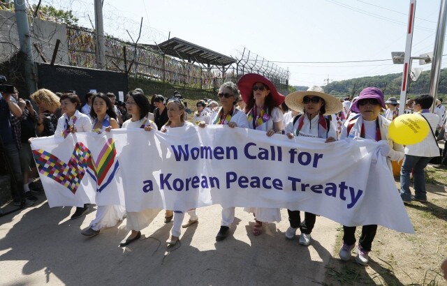 Female activists march along the DMZ in Paju