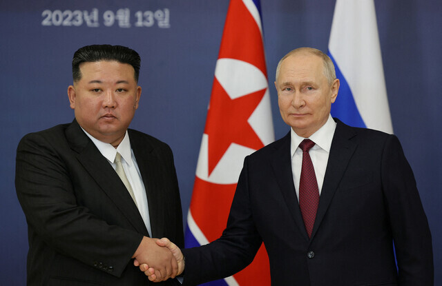 North Korean leader Kim Jong-un and Russian President Vladimir Putin stand for a photo to mark their summit at the Vostochny Cosmodrome in Russia on Sept. 13. (Yonhap)