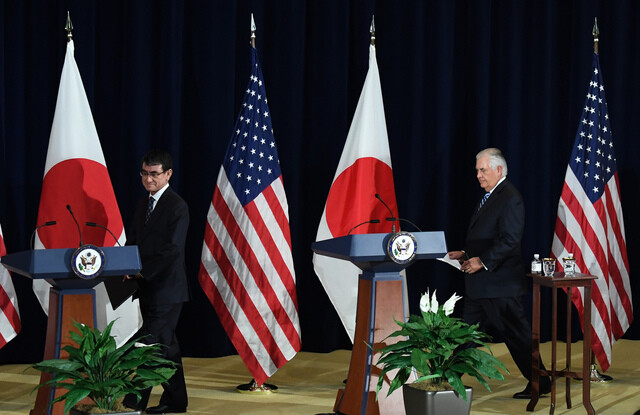 US Secretary of State Rex Tillerson (left) walks to the podium to begin a joint press conference with Japanese Foreign Minister Taro Kono following the US-Japan Security Consultative Committee Meeting that also included Defense Secretary James Mattis and Japanese Defense Minister Itsunori Onodera in Washington on Aug. 17. (Washington