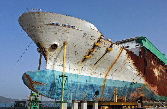 The salvaged hull of the Sewol ferry, pulled from the water in 2017, sits at a port in Mokpo on April 13, 2023, days before the ninth anniversary of its sinking. (Yonhap)