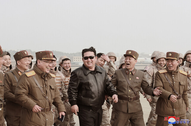 The Rodong Sinmun newspaper reported North Korean leader Kim Jong-un (center) was present for the launch of an ICBM on March 24 in its March 25 edition, accompanied by 16 photos. (KCNA/Yonhap News)