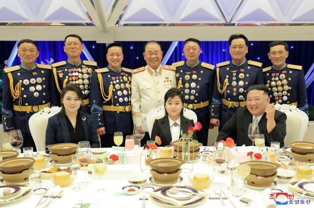 Photo ④: The state-run Rodong Sinmun newspaper reported that Kim Jong-un and his daughter Kim Ju-ae took part in a commemorative banquet for the 75th founding anniversary of the KPA on Feb. 7, 2023. Behind Kim, his daughter and his wife, are the top brass of the WPK and North Korea’s military. (KCNA/Yonhap)