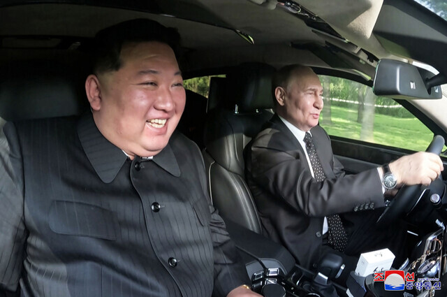 North Korean leader Kim Jong-un sits in the passenger seat as Russian President Vladimir Putin drives around the gardens at the Kumsusan State Guesthouse in Pyongyang, where the two “develop[ed] rapport” after signing their comprehensive strategic partnership pact on June 19, 2024. (KCNA/Yonhap)