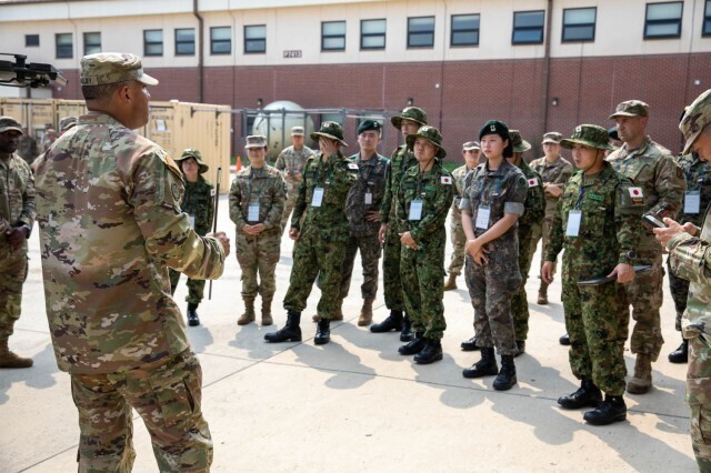 Officers in the Korean military and Japan’s self-defense force listen to a briefing from a US soldier at Camp Humphreys in Pyeongtaek, Gyeonggi Province, on July 5. (from the USINDOPACOM site)