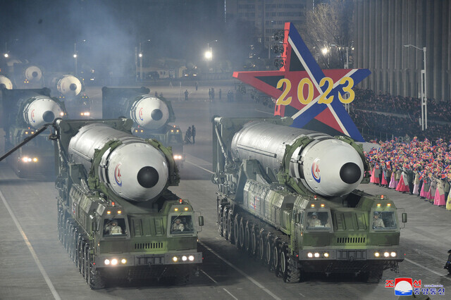 More than 10 Hwasong-17 ICBMs, shown here in this photo released by state media, were featured in the nighttime military parade in Pyongyang’s Kim Il-sung Square held for the 75th founding anniversary of the Korean People’s Army on Feb. 8. (KCNA/Yonhap)