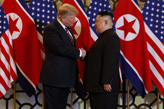 US President Donald Trump and North Korean leader Kim Jong-un shake hands ahead of their Hanoi summit on Feb. 27. (AP/Yonhap News)