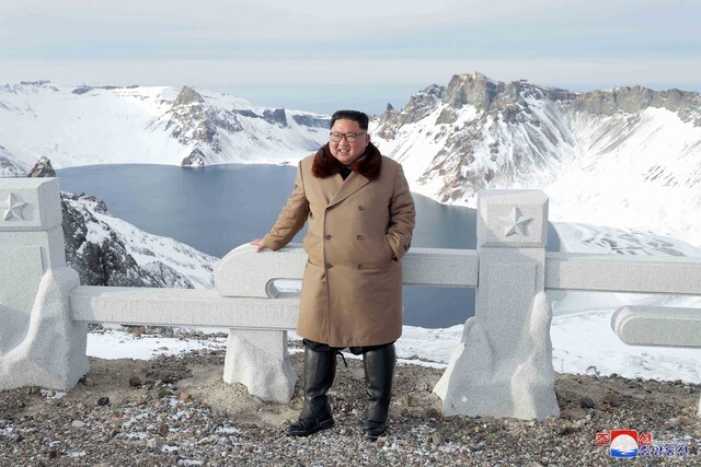 An image of North Korean leader Kim Jong-un in front of Cheonji, the crater lake at the top of Mt. Baektu, published by the Korean Central News Agency (KCNA) on Dec. 4. (Yonhap News)