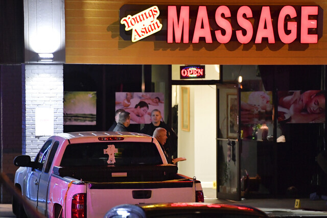 Authorities investigate a fatal shooting at Young’s Asian Massage on Tuesday in Acworth, Georgia. (AP/Yonhap News)
