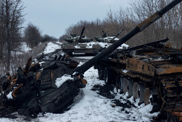 Charred and captured tanks litter a road in the Sumy region of Ukraine on March 7. (Reuters)