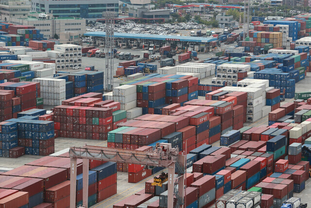 Freight containers fill a port in the southern city of Busan. (Yonhap)