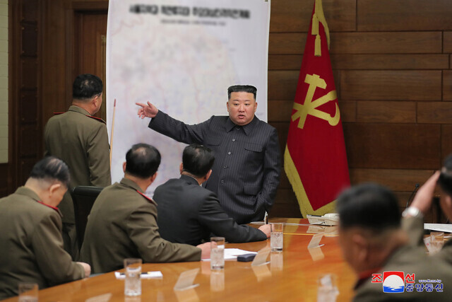 North Korean state media on April 11 released this photo of leader Kim Jong-un gesturing at a map of the South’s capital while attending an enlarged meeting of the Central Military Commission of the Workers’ Party of Korea. (KCNA/Yonhap)