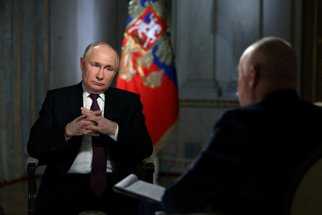 Russian President Vladimir Putin during a press interview with the director general of Russiya Segodnya media group on Mar. 12 in Moscow. (Sputnik/AP)