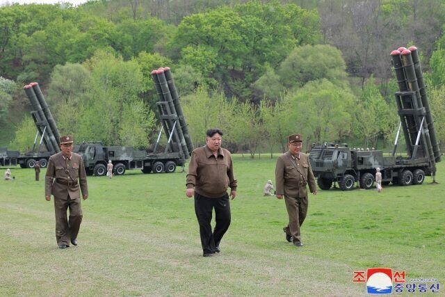 North Korea’s state-run Rodong Sinmun released this photo along with an article on April 23, 2024, which said that Kim Jong-un had overseen a simulated nuclear counterattack using 600 MM super-large multiple rocket sub-units in a drill of its “Nuclear Trigger” nuclear weapon combined management system on April 22. (KCNA/Yonhap)