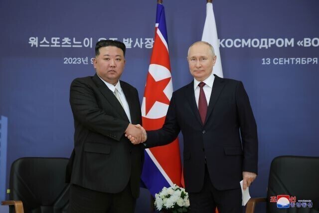 North Korean leader Kim Jong-un stands for a photo with Russian President Vladimir Putin during their summit in the Russian Far East on Sept. 13, 2023. (KCNA/Yonhap)