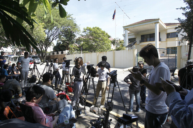 Reporters gather in front of the North Korean embassy in Kuala Lumpur