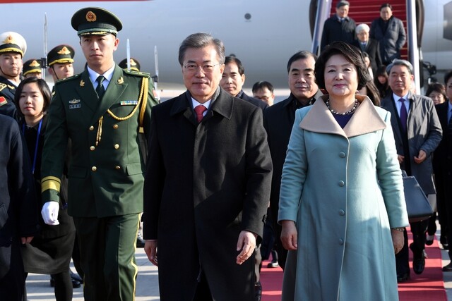 President Moon Jae-in arrives Beijing Capital International Airport to begin a four-day state visit to China on Dec. 13. (Yonhap News)