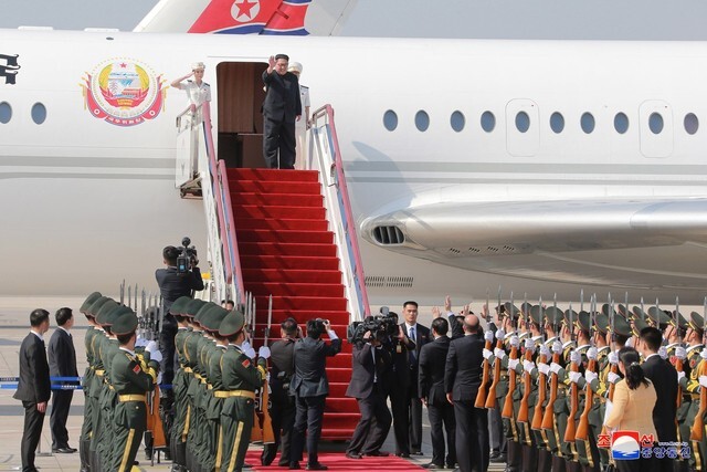 North Korean leader Kim Jong-un gets on his official airplane Chammae-1 after his summit with Chinese President Xi Jinping in Dalian in China’s Liaoning Province on May 7-8. (Korea Central News Agency