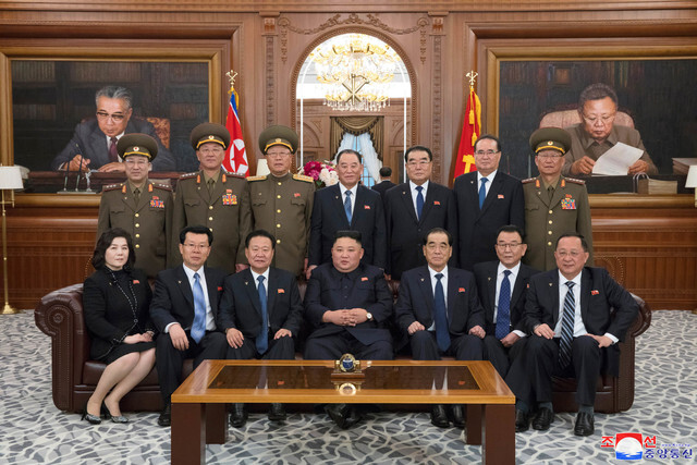 North Korean leader Kim Jong-un poses for a commemorative photograph with recently selected members of the Central Committee of the Workers’ Party of Korea on Apr. 12. (KCNA/Yonhap News)