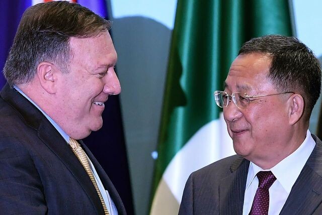US Secretary of State Mike Pompeo (left) greets North Korean Foreign Minister Ri Yong-ho at the ASEAN Regional Forum (ARF) in Singapore on Aug. 4. (AFP)