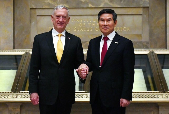 South Korean Defense Minister Jeong Kyeong-doo and US Secretary of Defense James Mattis shake hands during a banquet following the 50th South Korea-US Security Consultative Meeting on Oct. 31 in Washington