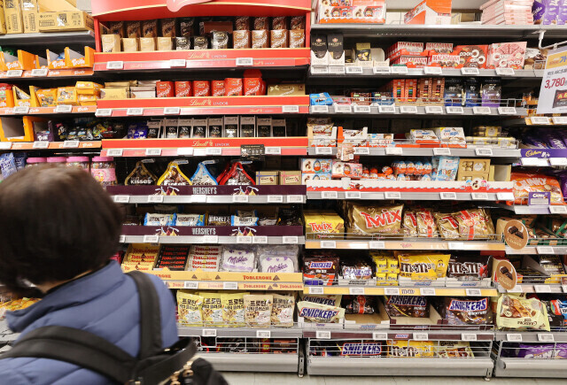 A person walks through the candy aisle at a supermarket in South Korea amid rising prices for confectionaries due to a steep jump in the price of cocoa. (Yonhap)